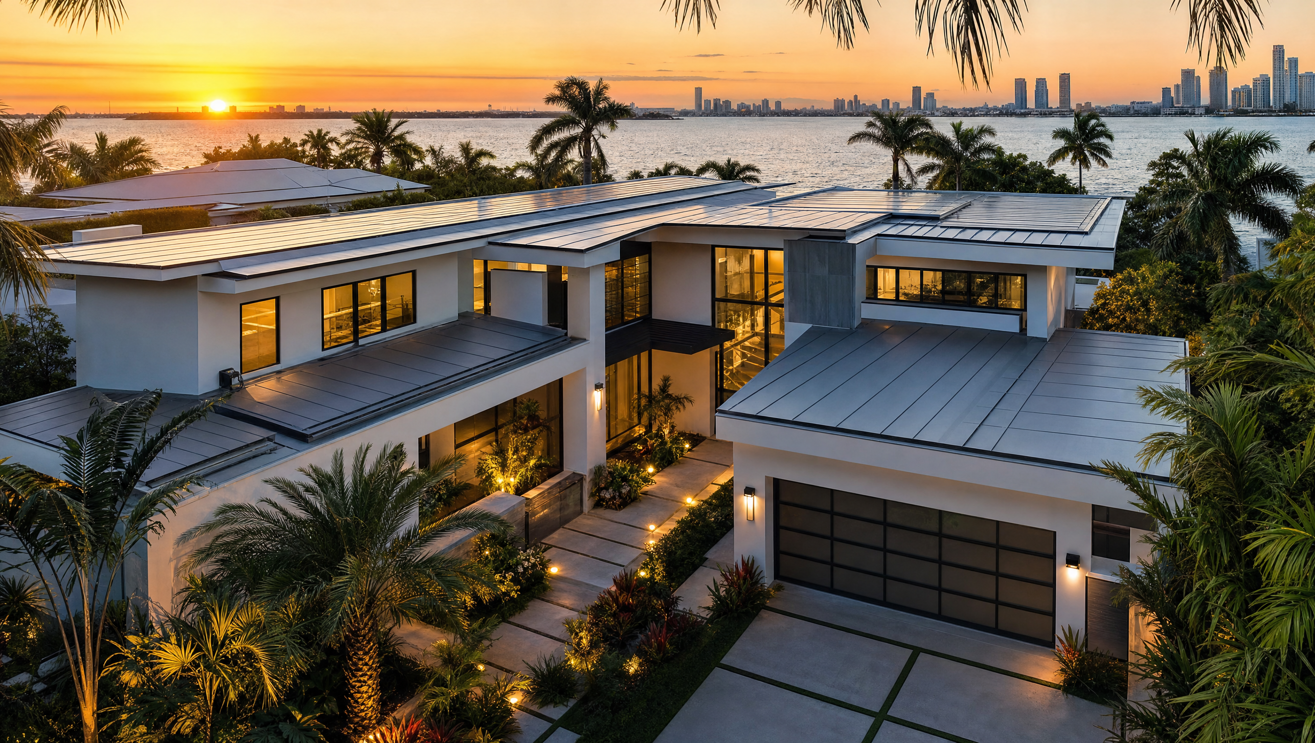 Standing-seam metal roof on a modern Miami waterfront home at sunset
